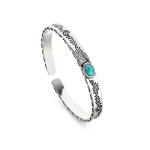 Vintage engraved open cuff bracelet for men featuring a blue turquoise gemstone centerpiece