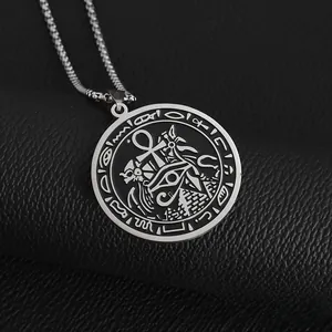 Detailed close-up of Eye of Horus and Ankh symbols on a silver pyramid pendant necklace