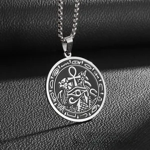 Close-up of stainless steel Egyptian pendant with Ankh, Eye of Horus, and pyramid symbols