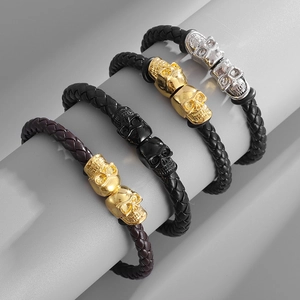 Punk style men's leather braided bracelet with magnetic skull clasp in multiple finishes