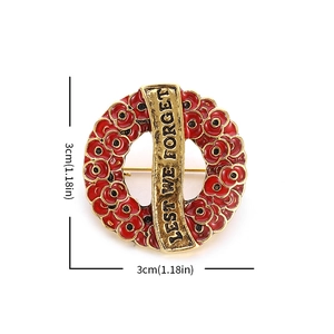 Red poppy enamel wreath brooch with Lest We Forget text in gold finish, 3cm diameter