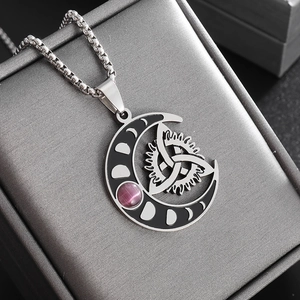 Detailed macro view of silver Celtic crescent moon pendant with purple stone on chain