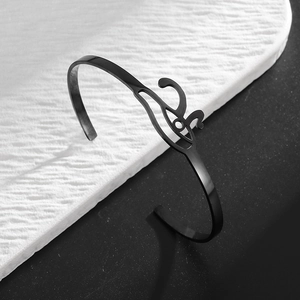 Matte black stainless steel Eye of Horus open cuff bracelet with intricate hollow details