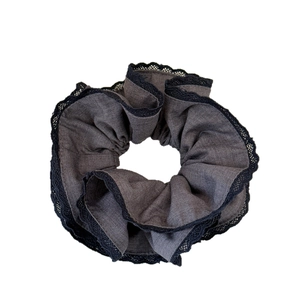 Elegant dark grey scrunchie with delicate black lace trim for vintage hair styling