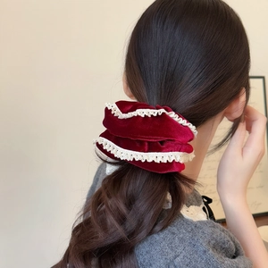 French velvet scrunchie in burgundy with lace trim worn on ponytail hair style