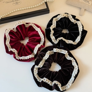 Three velvet hair scrunchies with lace trim in burgundy, black and brown colors