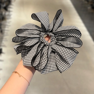 Classic black and white houndstooth oversized scrunchie with elegant bow design