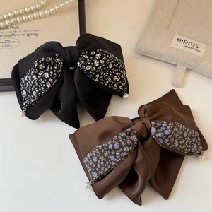 Elegant floral polka dot bow hair clips with pearls for French style hairstyles
