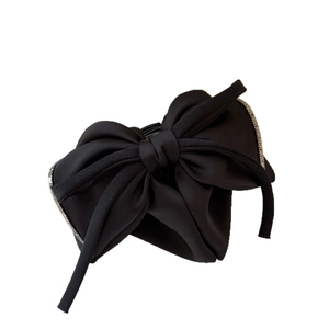 Elegant black satin bow hair claw clip with silver rhinestone trim for women's hairstyle