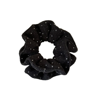 Retro black velvet scrunchie with white polka dots for stylish autumn hair styling