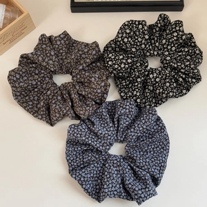 Three pieces of floral oversized scrunchies in various vintage patterns for women