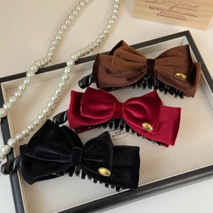 Elegant velvet bow banana clips in coffee, wine red, and black with golden metal detail