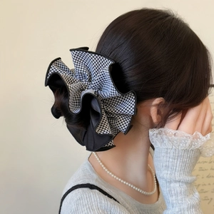 Large vintage gingham scrunchie with black wavy lace trim worn on a ponytail