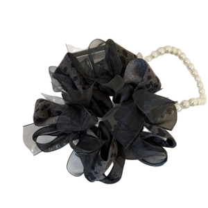 Elegant leopard print scrunchie with layered fabric and white faux pearl chain handle