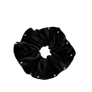 Elegant black velvet scrunchie with white pearl embellishments for hair styling