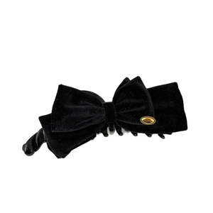 Elegant black velvet double bow banana clip with a refined gold emblem for women