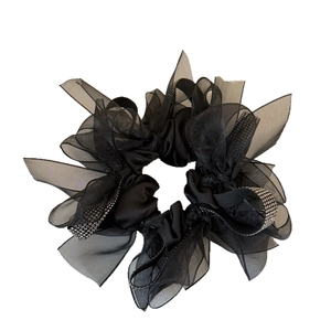 Black mesh scrunchie with rhinestones and ribbon bow design for elegant hairstyles