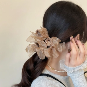 Elegant champagne organza oversized bow scrunchie for voluminous ponytail styling