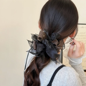 Floral organza scrunchie with layered fabric for ponytails and elegant hairstyles