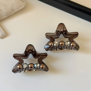 Star-shaped hair claw clips in dark coffee resin with pearls and sparkling rhinestones