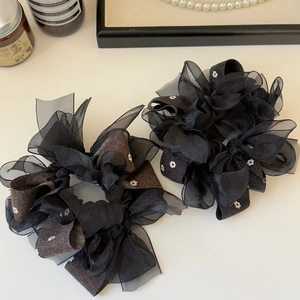 Elegant black organza scrunchie with floral pattern for aesthetic ponytail hairstyles