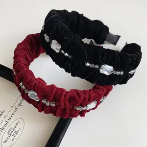 Detailed texture of velvet fabric and sparkling rhinestones on the vintage headbands