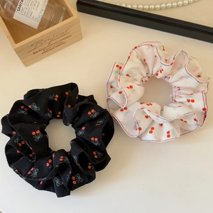 Sweet cherry and bow print scrunchies in black and white colors for ponytail styling
