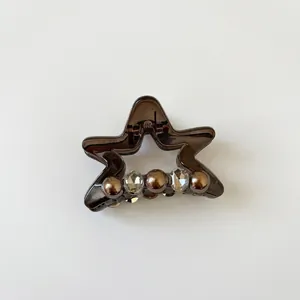 Exquisite star-shaped hair claw clip in dark brown with faux pearls and crystals