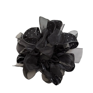 Retro black and white polka dot scrunchie made of layered mesh fabric for hair styling