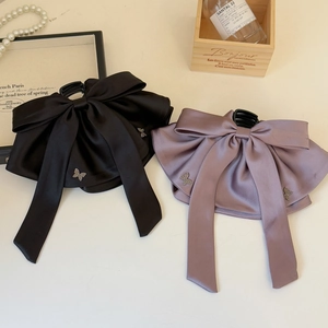 Elegant large satin bow hair clips in black and mauve with rhinestone butterfly details