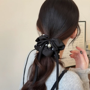 Elegant black polka dot bow hair scrunchie with white pearl pendant for high ponytail
