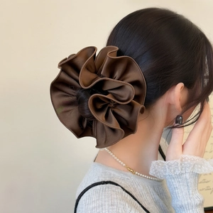 Detailed view of coffee brown layered chiffon scrunchie showing pleated silk texture