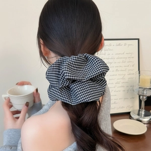 Classic black and white houndstooth oversized hair scrunchie shown on model back view