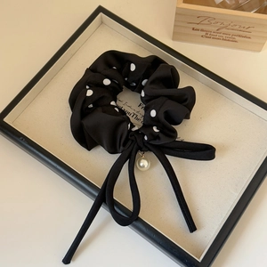 Polka dot bow scrunchie with long ribbons and pearl charm for elegant hairstyles