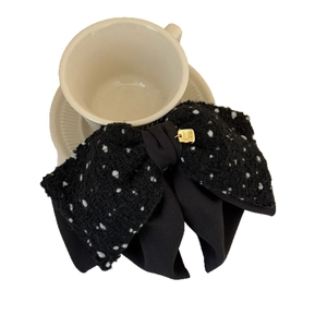 Elegant black tweed bow hair clip with white polka dots and gold pendant accessory
