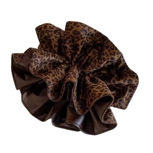 Fashionable leopard print and brown leather oversized scrunchie for hair styling