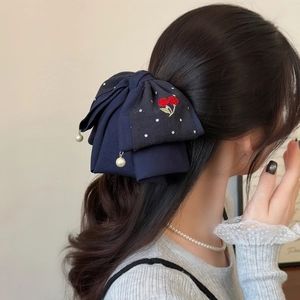 Elegant navy blue bow hair claw with floral embroidery and pearl drop charm for women