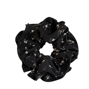 Retro floral scrunchie in black chiffon fabric with delicate white flower pattern