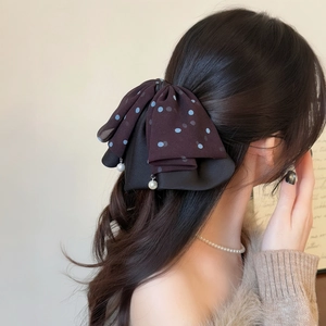 Elegant layered bow hair claw with blue polka dots and hanging pearl decorations
