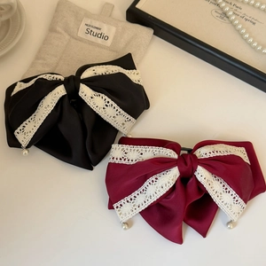 Elegant satin bow hair clips in black and burgundy with lace edges and pearls