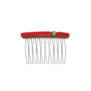 Detail of red acetate hair side comb with 11 silver metal teeth and wavy prongs design