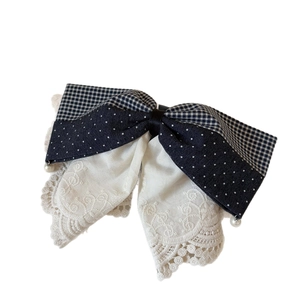 Navy blue lace layered bow hair clip with polka dots, plaid patterns and pearl details