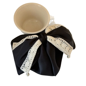Elegant black satin hair claw with delicate lace bow and pearl accents for women