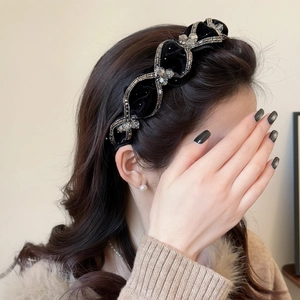 Luxurious black velvet headband with sparkling rhinestones and crystal chain decoration