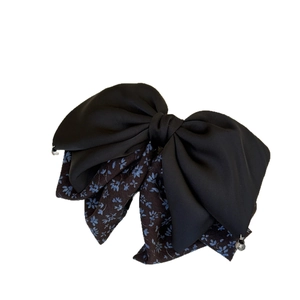 Elegant floral bow hair clip with black chiffon layers and small metal bead charms