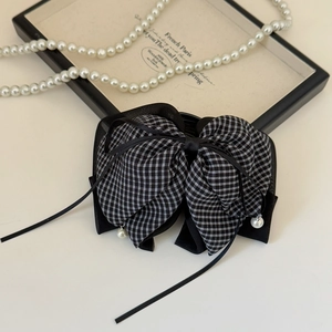 Elegant French checkered bow hair claw clip with black ribbons and pearl accents