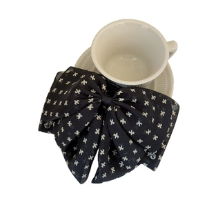 Elegant black polka dot bow hair claw clip with star patterns for French style ponytail