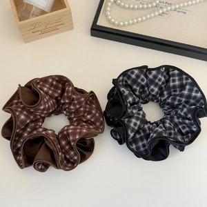 Set of two large plaid scrunchies in brown and grey with layered ruffles for ponytail