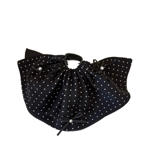 Elegant black polka dot hair claw clip with fabric bows and faux pearl accents