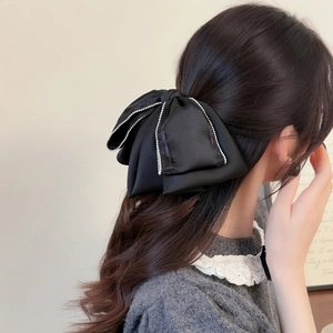 Elegant French black satin bow hair claw with sparkling rhinestone lace edging for women